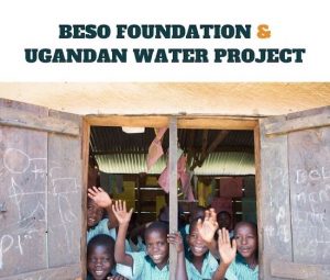 Ugandan children waving from schoolhouse window