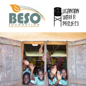 Ugandan children waving from schoolhouse window