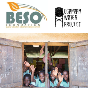 Ugandan children waving from schoolhouse window
